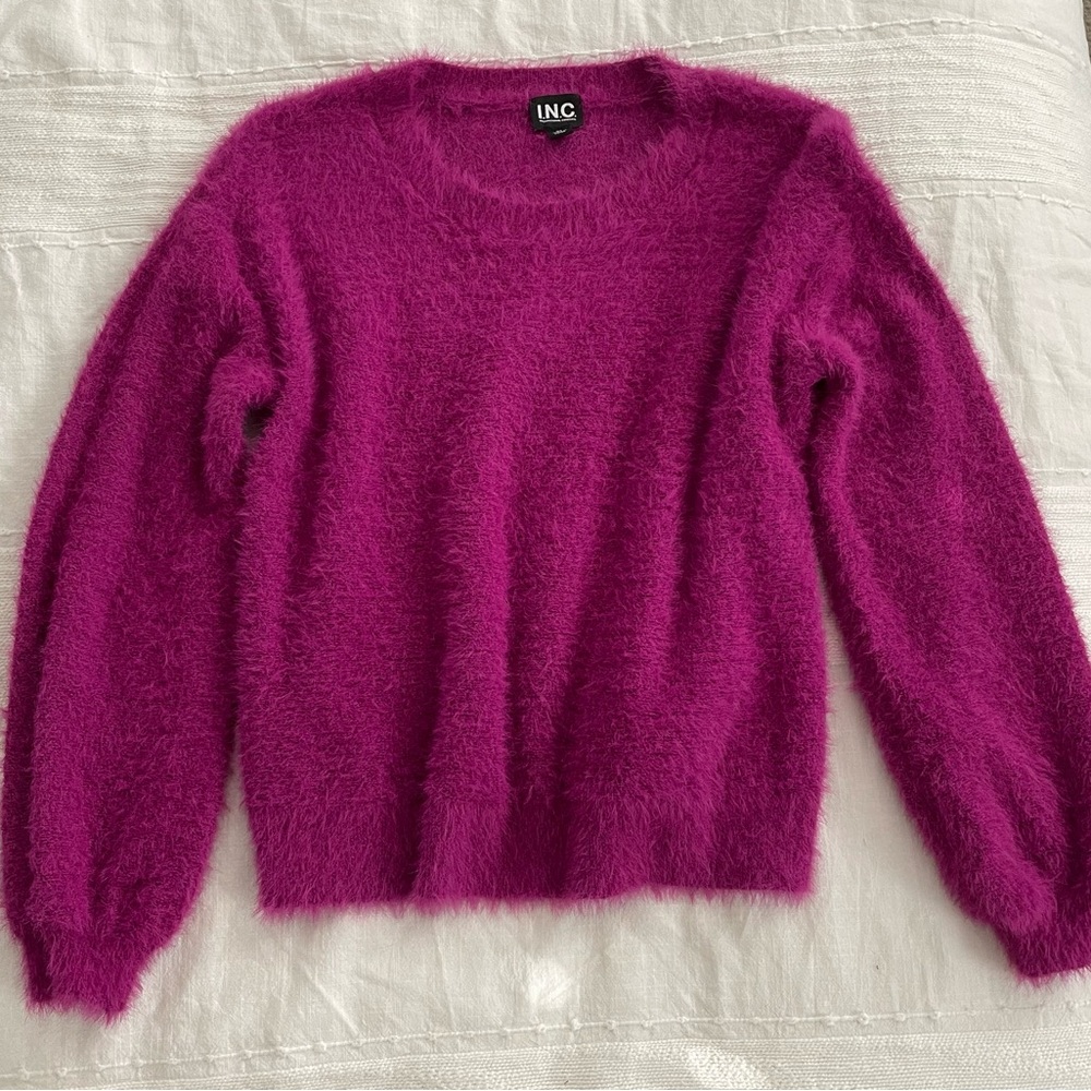 Pink fluffy sweater.